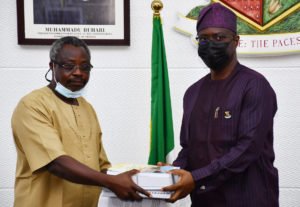 Makinde Receiving Report Of The Committee on LAUTECH From Professor Omole